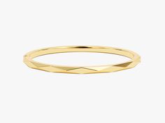 Crafted from the finest 14k gold, this bangle showcases a sleek, avant-garde geometric design. The clean lines and bold shapes make a powerful statement, turning your wrist into a canvas of modern sophistication. Wear it solo for a minimalist yet impactful look, or stack it with other bracelets to curate your unique style narrative.Features• Made to Order• Gold Kt: 14K• Gold Colors: Rose Gold, Yellow Gold, White Gold• Width: 3.70 mm• Thickness: 3.00 mm Modern Yellow Gold Bracelet With Shiny Finish, Modern Yellow Gold Cuff Bracelet With Shiny Finish, Modern Yellow Gold Bangle Bracelets, Modern 14k Gold Bangle Bracelets, Modern Diamond Cut Bangle For Formal Occasions, Modern Round Gold Bracelet For Formal Occasions, Modern Polished Bangle For Formal Occasions, Modern Formal Bangle With Diamond Cut, Modern Shiny Yellow Gold Cuff Bracelet