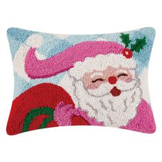 a christmas pillow with santa clause on it