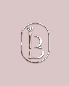 the letter b is made out of metal and has a diamond in it's center