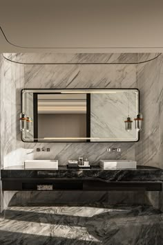 a marble bathroom with two sinks and a large mirror above the sink is an art deco style