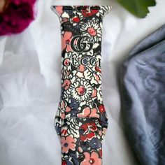 Welcome additional luxury to your Apple Watch with this exquisite GG Floral Silicone Watch Band. Soft and comfortable, its sophisticated design will add a touch of class to any occasion. Embrace a timeless look that exudes confidence, class, and sophistication!. *Beautiful silicone band *Standard Length *Available in 2 sizes: 38/40/41 MM and 42/44/45/49 MM *This band will fit every series of Apple Watches Apple Watches, Silicone Watch Band, Silicon Bands, Touch Of Class, Sophisticated Design, Apple Watch Band, Apple Watch Bands, Watch Band, Watch Bands