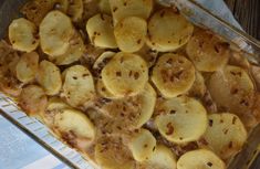 a casserole dish filled with potatoes and meat