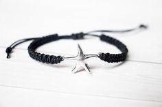 This bracelet has a Starfish silver tone connector, in a zinc alloy metal.  This bracelet is adjustable to ensure a great fit. Many colors to choose from. Photo shown is blue cotton cord.Sizes:Small (5.5 - 6.5 inches)Medium (6.5 - 7.5 inches)Large (7.5 - 8.5 inches)These charms are made from a zinc alloy metal which is lead and nickel free. Measurements: 24mm x 17mm*Avoid getting the bracelet wet to lengthen the life of your bracelet*Please review the listing description and feel free to ask any Adjustable Metal Star Bracelet, Adjustable Star Shaped Metal Bracelets, Adjustable Star-shaped Metal Bracelets, Adjustable Star-shaped Metal Bracelet, Adjustable Silver Star Bracelets, Adjustable Silver Star Bracelet, Adjustable Sterling Silver Star Bracelet, Adjustable Silver Metal Friendship Bracelets, Adjustable Silver Metal Friendship Bracelet