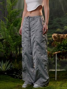 The Dusk Parachute Pants feature a satin fabric body in a loose straight-leg fit. Shaped panels with seam details along the front and back. GRKC print to the leg alongside a logo embossed button closure. Hardware adjustable drawcord waist finished off with signature GRKC garment labels. Satin Fabric Logo Print Seam Details Loose Fit No Restocks 100% Polyester Unisex Model Eli is 185cm / 6'1" tall and wearing size XL *Please allow 1-2 weeks for processing and shipment. Fabric Logo, Garment Labels, Satin Fabric, Logo Print, Parachute Pants, Straight Leg, Loose Fitting, Satin, Pants