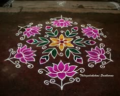 a flower design on the ground with white and pink flowers painted on it's surface