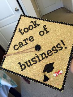 a graduation cap that says, took care of business