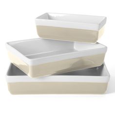 two white dishes stacked on top of each other