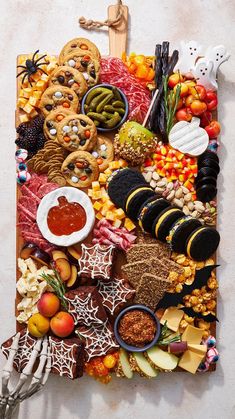 a table topped with lots of different types of food and snacks on top of it