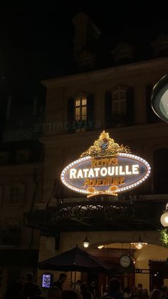 the sign for ratatoulie is lit up at night