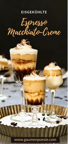 three glasses filled with desserts sitting on top of a metal tray next to each other