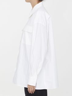 Leo Pocket shirt in white cotton. It features pointed collar, front button closure, two flap pockets on chest, buttoned cuffs and curved hem. Oversized fit. The model is 180cm tall and wears size IT 40. Size nationality: IT Product number: 3587495 Product code: ARMTMT005C003001 Composition: 100% cotton White Button-up Dress Shirt With Pockets, Classic White Blouse With Roll-up Sleeves, Oversized White Blouse With Placket, Oversized White Top With Lapel Collar, White Oversized Top With Lapel Collar, Modern White Blouse With Concealed Placket, Oversized White Shirt With Pockets, Modern White Blouse With Placket, White Tops With Lapel Collar And Concealed Placket