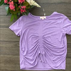 Beautiful Lilac Top From Dillard’s Exclusive Brand Gb Girls. Shirt Was Not Worn But Tags Were Taken Off. Front Tie Can Be Tightened To Loosened. Cute Purple Top For Spring, Stretch Purple T-shirt For Spring, Lilac Top, Girls Shirt, Color Purple, Shirts For Girls, Kids Shirts, Shirts Tops, Lilac