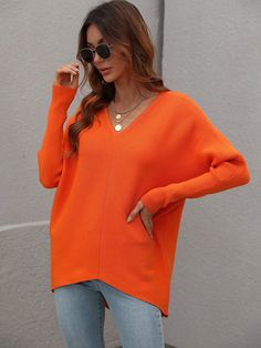 Our Clia Knit comes in a neon orange colour in an oversized drape fit. This features a heart neckline and open V back collar, batwing long fitted sleeves, and a roomy fit making this ideal for growing baby bumps. This piece is made from lightweight breathable material which is perfect for a trans-seasonal outfit. Pair with jeans for a lazy day outfit or complete the look with our Jady Rose Heels. Size Guide: Ambre is 5’2” tall, and has a 33.2” bust, 24.5”waist, & 36.7” hips. She is wearing a S / Orange Outfits, Outfits Female, Oversized Sweater Women, Solid Color Sweater, Transition Outfits, Women Sleeve, Tunic Sweater, Oversized Sweater, Sweater Fashion