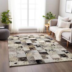 a living room with a large rug on the floor and a chair in front of it