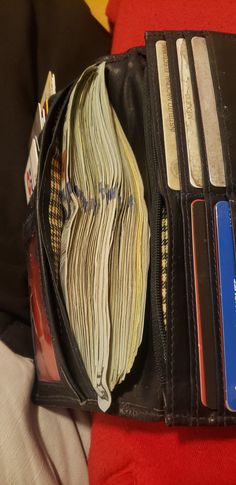 an open wallet with several credit cards in it