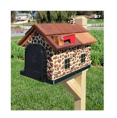 a mailbox with a giraffe print on it