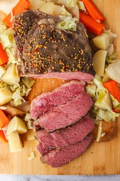 corned beef, cabbage and carrots on a cutting board