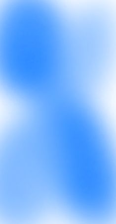 a blurry blue and white background with some clouds in the sky, as well as an area for text