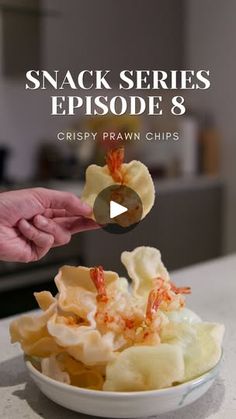 a person is picking up some food from a bowl on a counter top with the caption snack series episode 8 crispy prawn chips