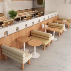 a row of tables and benches in a restaurant