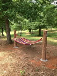 a hammock hanging between two wooden posts