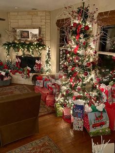 a decorated christmas tree in a living room with presents on the floor next to it