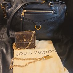 Already Authenticated By Poshmark. Authentic Lv Empriente Infini Leather Bag In Dark Blue Color. It Features Tall Leather Straps, A Front Zipper Pocket, Shiny Hardware,Striped Fabric Interior. Condition Excellent Used Condition. No Stains,Smell,Rips Corners Are Perfect. No Peeling. Only Call Out If U Say That Is Some Rubbing At The Top On Right Side Of Zipper. Which Is Nothing.Check Out Last Pic. U Can't Even Notice That . Other Than That Bag Is In Pristine Condition. U Get Dustbag,One Lock And Key With Necklace , One Small Lv Wallet,Good Condition, Cleaned And Satin Shined And Gold Chain With It. Please See Pics For Details. Questions Are Most Welcome. Both The Chains Are Unbranded. Pleas Lv Wallet On Chain, Navy Bag, Lv Wallet, Louis Vuitton Empreinte, Striped Fabric, Lock And Key, Dark Blue Color, Striped Fabrics, Louis Vuitton Bags