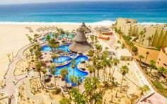 an aerial view of the beach and pool area at hotel riu canculla