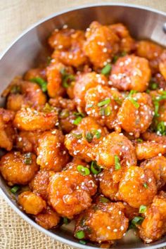 a bowl filled with fried food on top of a table