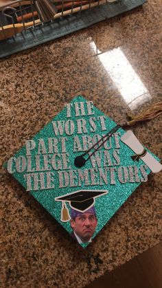 a green cap that says the worst part of college was the dementiary