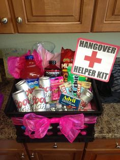 a kitchen counter with a sign that says hangover helper kit and various items in it