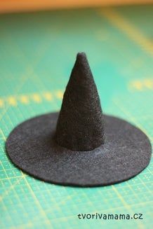 a small black hat sitting on top of a table