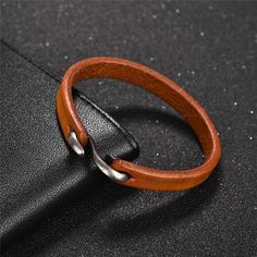 Inspired by the limitless, this uniquely designed vintage leather bracelet for men is a brilliant statement of urban style. Made of soft genuine leather with an elegant and stylish infinity inspired metal alloy hook clasp - this is an amazing contemporary piece that is a great balance of urban elegance and classical ch Hook Bracelet, Metal Cuff Bracelet, Leather Bangle, Genuine Leather Bracelet, Men Bracelet, Mens Leather Bracelet, Leather Cuffs Bracelet, Trendy Jewelry, Metal Bracelets