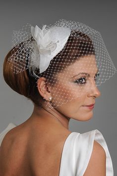 This is a handmade ivory wedding fascinator mini hat with soft floral leaves, a hair comb, and a birdcage netting veil. It is available in off-white color, which goes with common wedding dress colors. They look great with contemporary dresses, particular shorter ones. It is made in a standard one-size, and it has a hair comb under it, so it can be worn easily without the support of a hairdresser. It will be carefully packed, and returns are accepted for products with labels. Other models are ava Adjustable White Headpiece For Wedding, Adjustable Fascinator For Wedding, Adjustable Wedding Fascinator, White Pinched Crown Hat For Wedding, White Wedding Costume Hat With Pinched Crown, White Wedding Hat With Pinched Crown, Adjustable Pinched Crown Hat For Wedding, Wedding Mini Hat With Pinched Crown, Adjustable Bridal Hat For Wedding