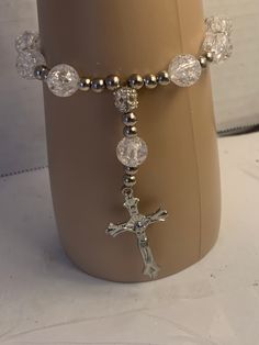 Pewter crucifix on beaded rosary bracelet Crucifix Shaped Jewelry With Faceted Beads As Gift, Crucifix Jewelry With Faceted Beads As Gift, Crucifix Jewelry With Faceted Beads For Gift, Cross-shaped Faceted Beads For Jewelry Making, Adjustable Silver Beaded Bracelets With Cross Shape, Adjustable Silver Cross Beaded Bracelets, Adjustable Silver Beaded Cross Bracelets, Adjustable Silver Cross Rosary Bracelet, Silver Cross Jewelry With Beads