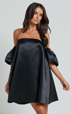 Turn heads and steal the show in our Rhaella Mini Dress! This playful off-the-shoulder dress features puff sleeves and a structured A-line silhouette that is perfect for any party night. Made from high-quality polyester, this black mini dress is both comfortable and stylish. Whether you're hitting the dance floor or going out for cocktails with friends, the Rhaella Mini Dress will have you feeling confident and flirty all night long. So go ahead, rock that 3/4 sleeve look and make a statement wh Summer Party Off Shoulder A-line Dress, Off-shoulder Puff Sleeve Dress For Summer Parties, Summer Off-shoulder Puff Sleeve Party Dress, Summer Off-shoulder Puff Sleeve Dress For Party, Spring Evening Off Shoulder Mini Dress, Chic Off-shoulder Puff Sleeve Dress For Date Night, Spring Evening Mini Off Shoulder Dress, Summer One-shoulder Puff Sleeve Dress For Party, One-shoulder Puff Sleeve Summer Party Dress