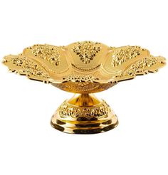 a gold plate that is on top of a stand