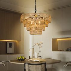 a dining room table with chairs and a chandelier hanging from it's ceiling