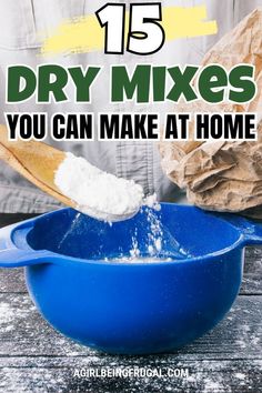 a blue mixing bowl filled with dry mixes on top of a wooden table