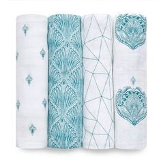 four white towels with blue designs on them