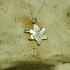 .999 fine silver Star of David pendant 5/8in. x 3/4in. Dove with CZ eye blended to form the star. Sterling silver 16in. chain.  The dove forms the second triangle of the star. The theme is peace. A perfect gift for any woman in you life. Great Bat Mitzvah gift. Silver Star Of David Fine Necklace, Shirley Brown, Silver Star Of David Necklace, Gold Sterling Silver Star Of David Necklace, Silver Star Of David Pendant In 14k Gold, Nickel-free Sterling Silver Star Of David Necklace, Bat Mitzvah Gifts, The Dove, Star Of David Pendant