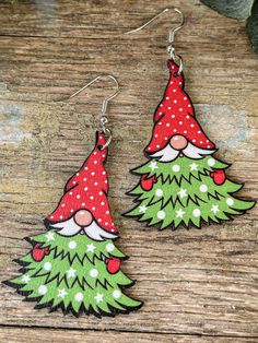 Add a dose of vintage charm to your holiday style with our 3" long Wooden Drop Earrings. These earrings are a festive fusion of nostalgia, featuring an adorable gnome wearing a Christmas tree. Crafted with love from wood, they're the perfect accessory to showcase your holiday spirit and love for all things vintage. Size: 3 inches Metal: Zinc Alloy, good for 99% of allergies Gnome Christmas Tree, Christmas Tree Wooden, Glowforge Ideas, Wood Items, Fun Ornaments, Gnome Christmas, Book Jewelry, Wood Ideas, Bead Loom