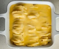 a casserole dish with cheese in it