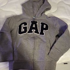 New Full Zip Hoodie Gray Size 5 Sweatshirt Check Out My Closet For Other Brands Puma, Disney, Gymboree, Oshkosh, Lego Carters, Old Navy, Baby Gap, Jumping Beans, Cat & Jack, Polo, Carhartt, Keen, Nautica, Nike, Under Armour, John Deer, Ralph Lauren, Columbia, Bogs, Lego, Pixar, New Balance Boy And Girl Make A Bundle For An Additional Discount! Cheap Basic Gap Bottoms, Gap Cotton Hooded Top, Gap Sporty Long Sleeve Tops, Sporty Long Sleeve Tops By Gap, Gap Long Sleeve Fleece Sweatshirt, Sporty Gap Tops For Winter, Gap Fleece Hooded Tops, Gap Fleece Long Sleeve Outerwear, Gap Long Sleeve Top With Letter Print