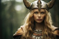 a woman dressed as a viking with horns on her head is staring at the camera