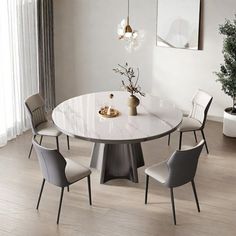 a dining table with four chairs around it