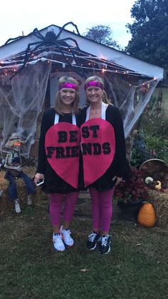 two girls dressed up in costumes standing next to each other with the words best friends written on them