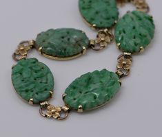 "This is a 14K YG Antique Carved Jadeite bracelet with 5 pierced and floral carved placques with gold flowers bewtween each circa 1930; 10/16\" width of Cabochon, weight 19.2 grams, Bracelet 6\" length with guard chain Stock # BB79A02" Boston Ma, Blue Topaz Ring, Topaz Ring, Gold Flowers, Pink Tourmaline, Chain Link Bracelet, Link Bracelets, Blue Topaz, Chain Link