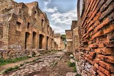 an old street with brick buildings and cobblestones