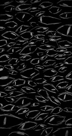 an abstract black and white photo with lots of small fish in the water, looking like they're swimming